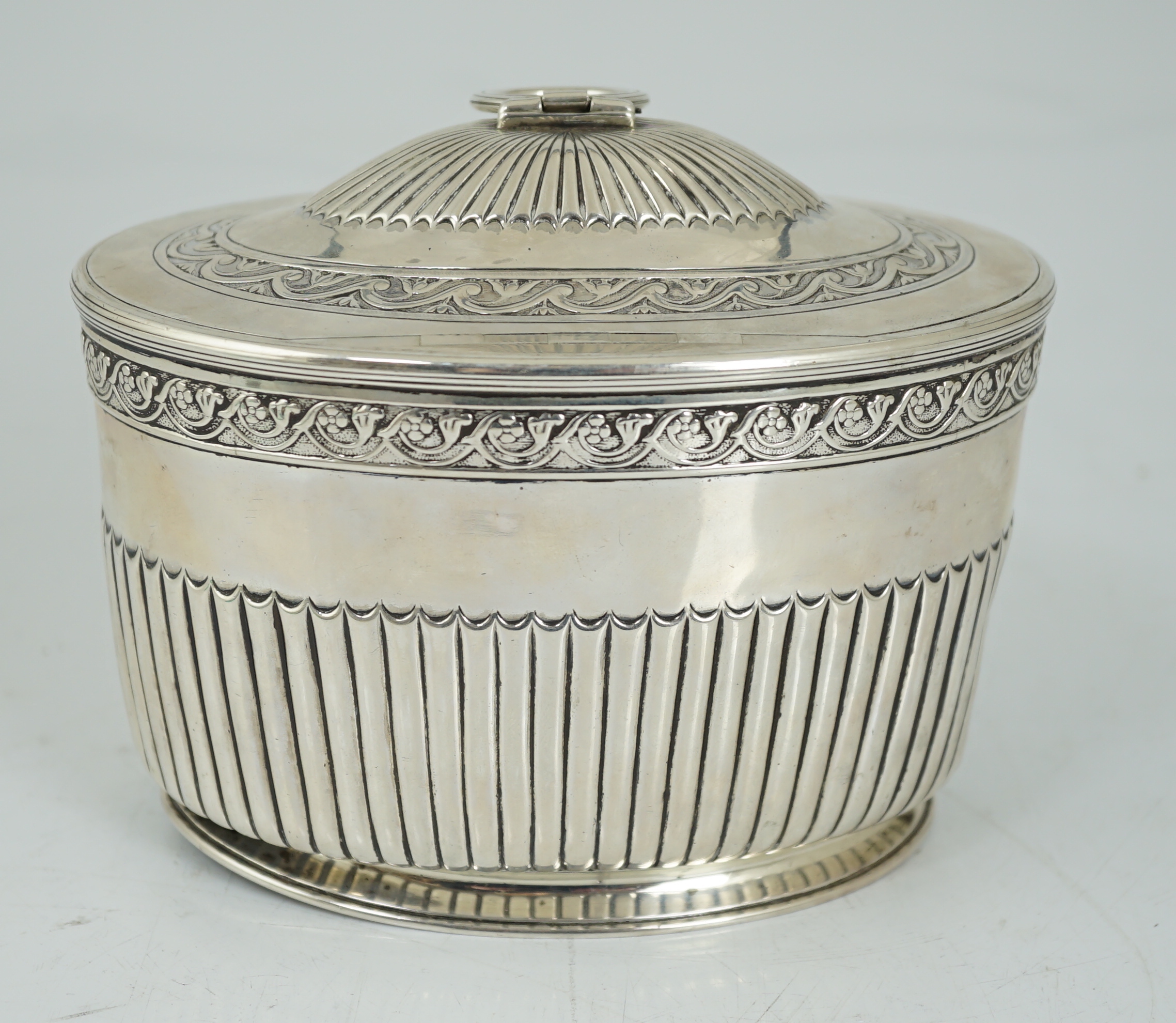 A George III demi fluted silver oval tea caddy by Andrew Fogelberg & Stephen Gilbert